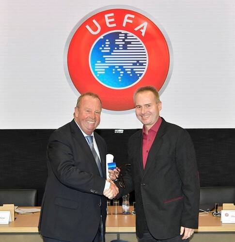 NYON, SWITZERLAND - NOVEMBER 15:  UEFA Medical Committee Chairman D'Hooghe welcomes new member Zsolt Szelid with a pin during the UEFA Medical Committee meeting at the UEFA headquarters, the House of European Football on November 15, 2017 in Nyon, Switzerland. (Photo by Harold Cunningham - UEFA/UEFA via Getty Images)