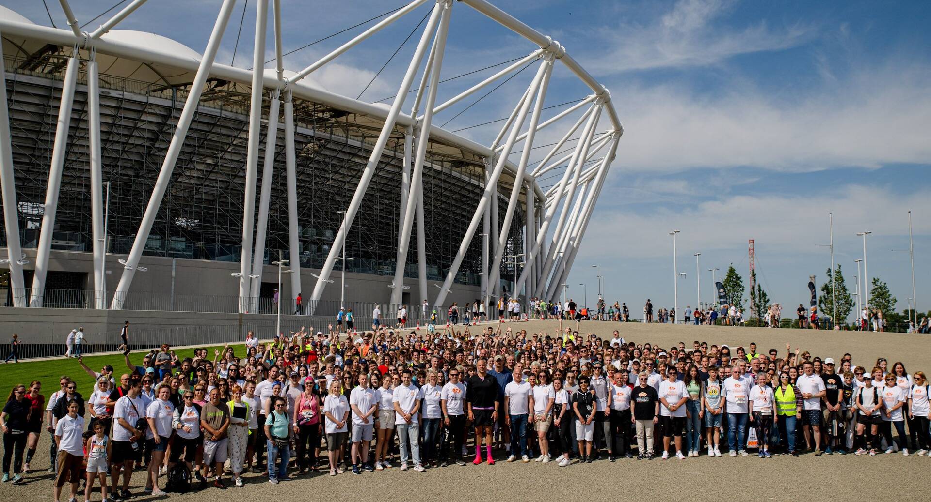 More than 1,200 volunteers participate in a site tour at the National Athletics Centre
